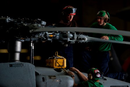 US Navy 111005-N-TU221-008 Sailors assigned to the Saberhawks of Helicopter Maritime Strike Squadron (HSM) 77 perform maintenance on the propellers