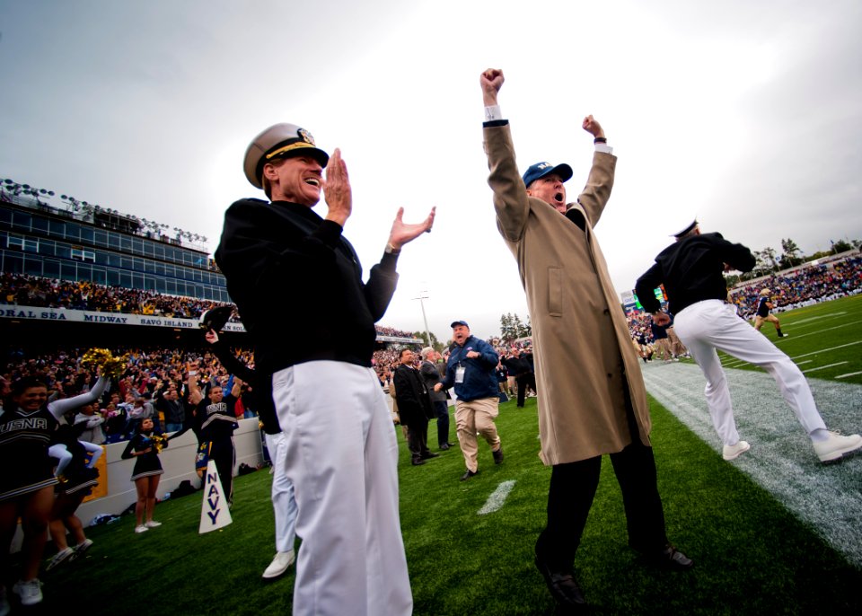 US Navy 111001-N-AC887-012 Secretary of the Navy (SECNAV) Ray Mabus cheers from the sideline as the U.S. Naval Academy Midshipmen recover an onside