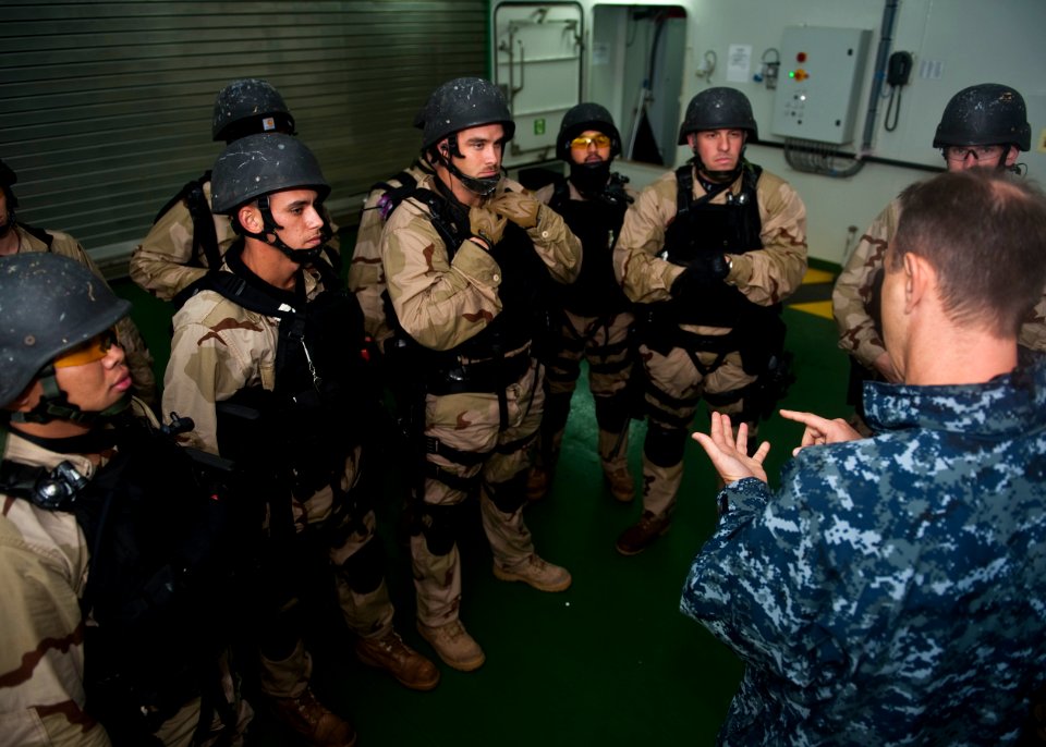US Navy 111006-N-FI736-240 The visit, board, search and seizure team assigned to the guided-missile destroyer USS Arleigh Burke (DDG 51) is debrief