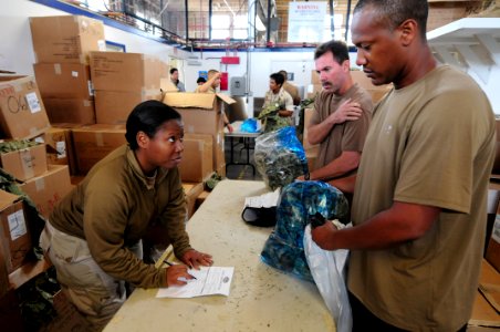 US Navy 111005-N-GT324-032 A Sailor assigned to Naval Special Warfare Logistics Support Unit (LOGSU) 1, outfits Chief Yeomen Lawrence Davis