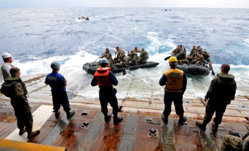 US Navy 111006-N-MW330-360 Sailors assigned to the forward-deployed amphibious dock landing ship USS Germantown (LSD 42)