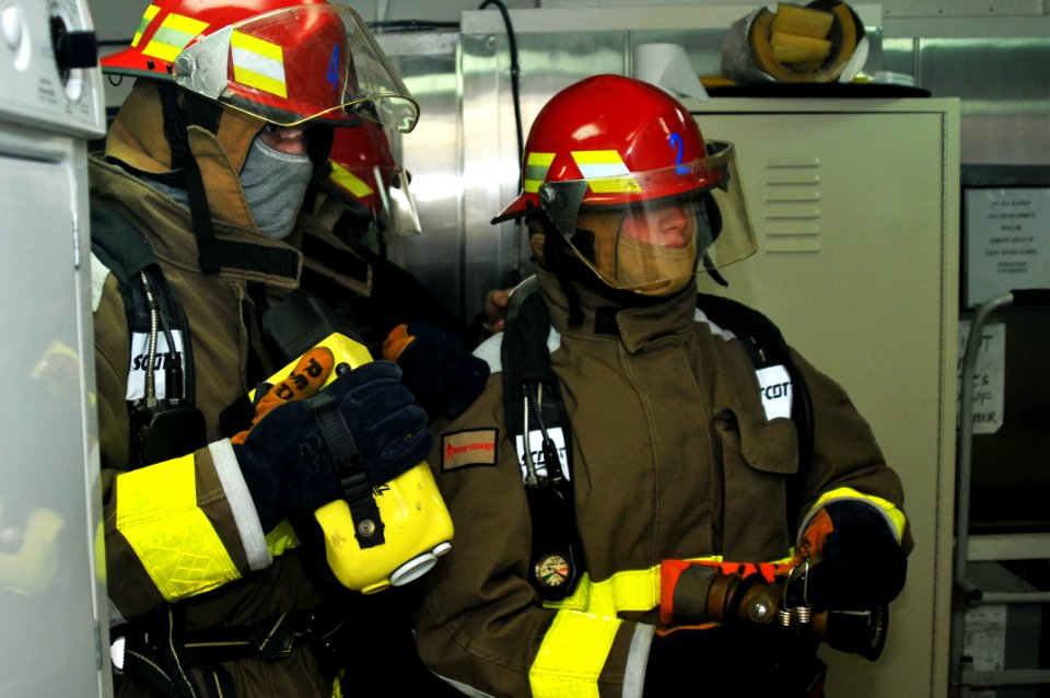US Navy 111004-N-JH293-027 Sailors aboard the submarine tender USS Emory S. Land (AS 39) combat a simulated class alpha