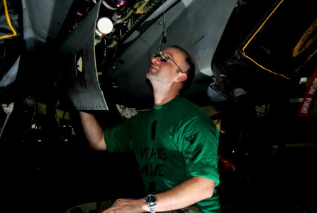US Navy 111005-N-VD490-002 Aviation Structural Mechanic (Equipment) 2nd Class Randy Horomicho, from Wagner, S.D., performs maintenance on the opti