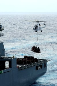 US Navy 111003-N-WA347-482 An SA-330J Puma helicopter picks up pallets of supplies from the Military Sealift Command dry cargo and ammunition ship