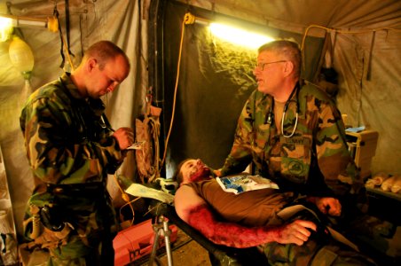 US Navy 111004-N-SM578-078 Seabees assigned to Naval Mobile Construction Battalion (NMCB) 40, conduct a mass casualty drill at Fort Hunter, Liggett