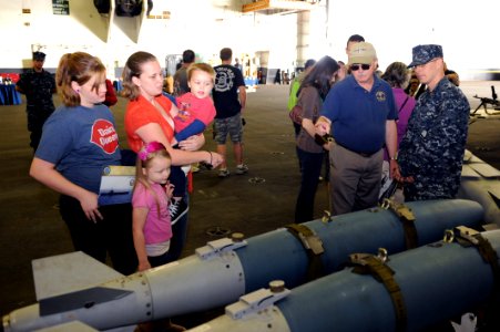 US Navy 111008-N-AU622-016 Visitors tour the hangar bay of the aircraft carrier USS Dwight D. Eisenhower (CVN 69) during Fleet Fest