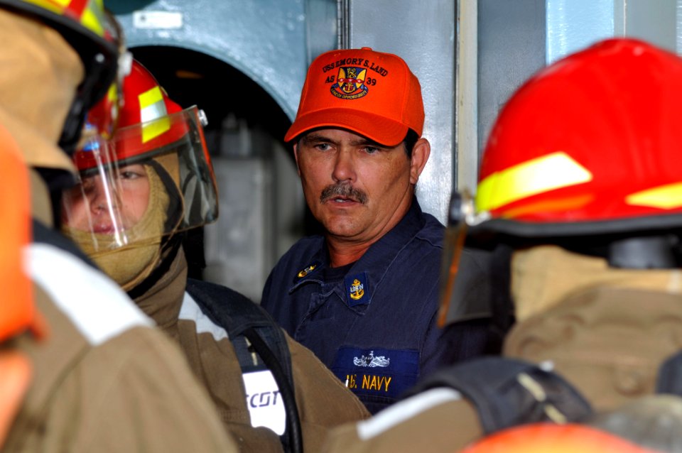 US Navy 111004-N-JH293-009 Chief Hull Maintenance Technician Richard Iverson instructs Sailors aboard the submarine tender USS Emory S. Land (AS 39