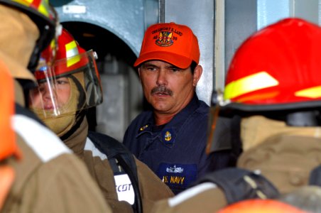 US Navy 111004-N-JH293-009 Chief Hull Maintenance Technician Richard Iverson instructs Sailors aboard the submarine tender USS Emory S. Land (AS 39