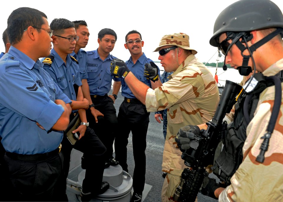 US Navy 111003-N-VH839-009 MUARA, Brunei (Oct. 3, 2011) Fire Controlmen 3rd Class Bryan Courtney, left, and Matthew Burger, members of the visit,