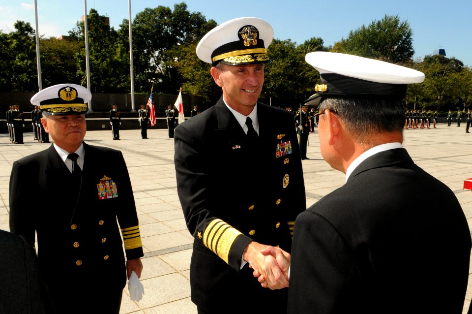 US Navy 111004-N-MU720-067 Chief of Naval Operations (CNO) Adm. Jonathan Greenert with his counterpart, Adm. Masahiko Sugimoto, greets an officer o