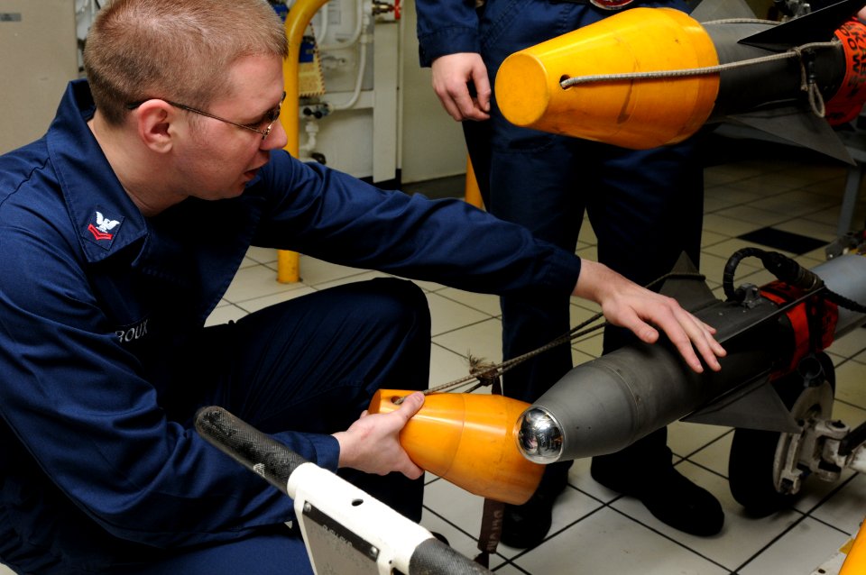 US Navy 111003-N-YC505-045 Aviation Ordnanceman 2nd Class Richard K. Roux inspects ordnance aboard the aircraft carrier USS George H.W. Bush (CVN 7