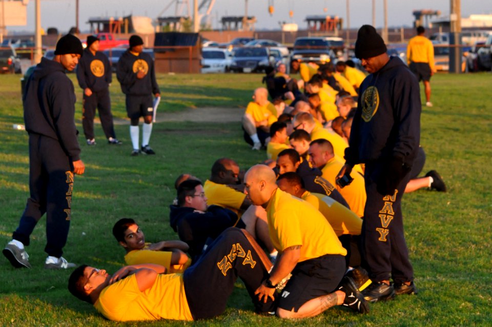 US Navy 111005-N-YX169-050 Command Fitness Leader (CFL) Chief Quartermaster Bryant Burnett, right, and CFL Assistant Machinist's Mate 1st Class Fel