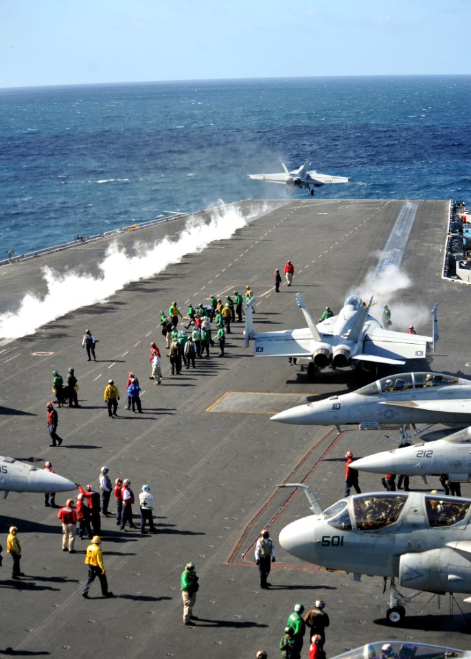 US Navy 111006-N-YB753-077 Aircraft assigned to Carrier Air Wing (CVW) 2 launch from the flight deck of the Nimitz-class aircraft carrier USS Abrah