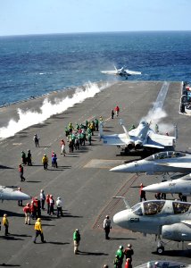 US Navy 111006-N-YB753-077 Aircraft assigned to Carrier Air Wing (CVW) 2 launch from the flight deck of the Nimitz-class aircraft carrier USS Abrah