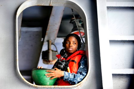 US Navy 111005-N-JO245-130 Seaman Jasmine Pinckney, from Philadelphia, observes a rigid-hull inflatable boat drill