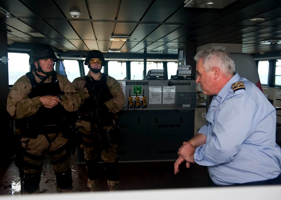 US Navy 111006-N-FI736-107 Chief Fire Controlman Michael Benavidez, left, and Lt. j.g. Cameron Carlson, both assigned to the destroyer USS Arleigh