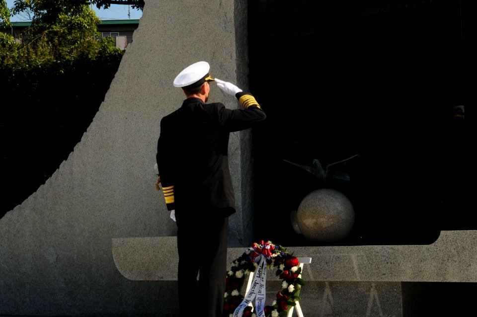 US Navy 111004-N-MU720-013 Chief of Naval Operations (CNO) Adm. Jonathan Greenert pays tribute during a wreath-laying ceremony at the Japan Ministr