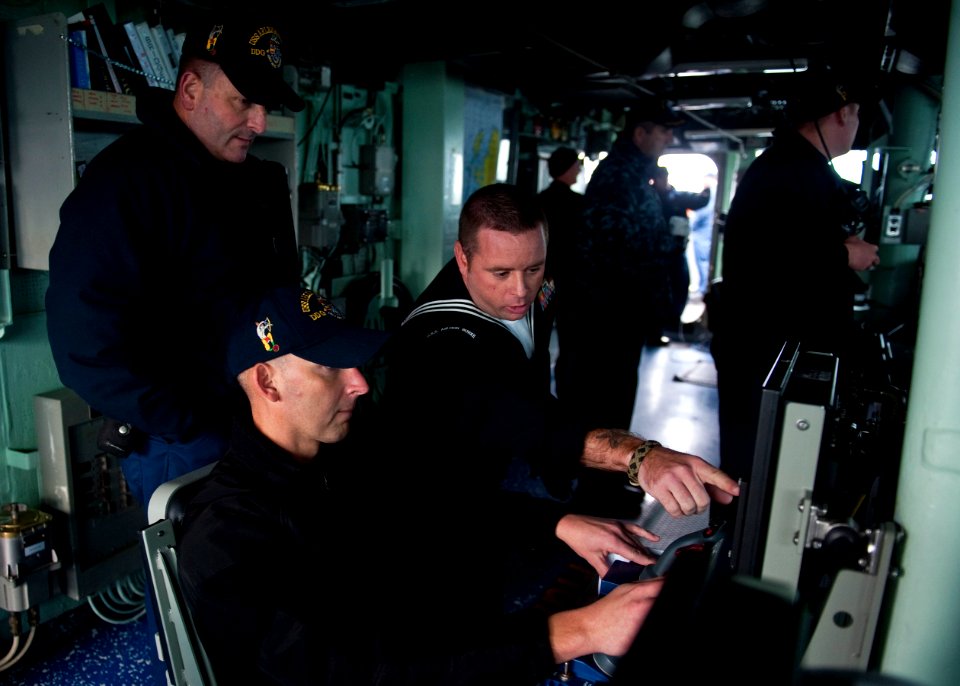 US Navy 111009-N-FI736-105 Gunners Mate 1st Class Wayne Schiattareggia, right, shows Fire Controlman 1st Class Farest Davis the proper procedure fo