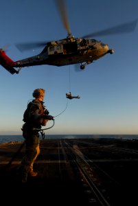 US Navy 111006-N-DU438-056 ailors assigned to Explosive Ordnance Disposal Mobile Unit (EODMU) 2 rappel from an MH-60S Sea Hawk helicopter assigned