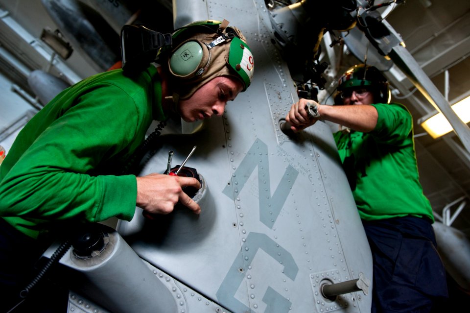 US Navy 111007-N-BT887-196 Sailors install the tail fairing on an MH-60S Sea Hawk helicopter