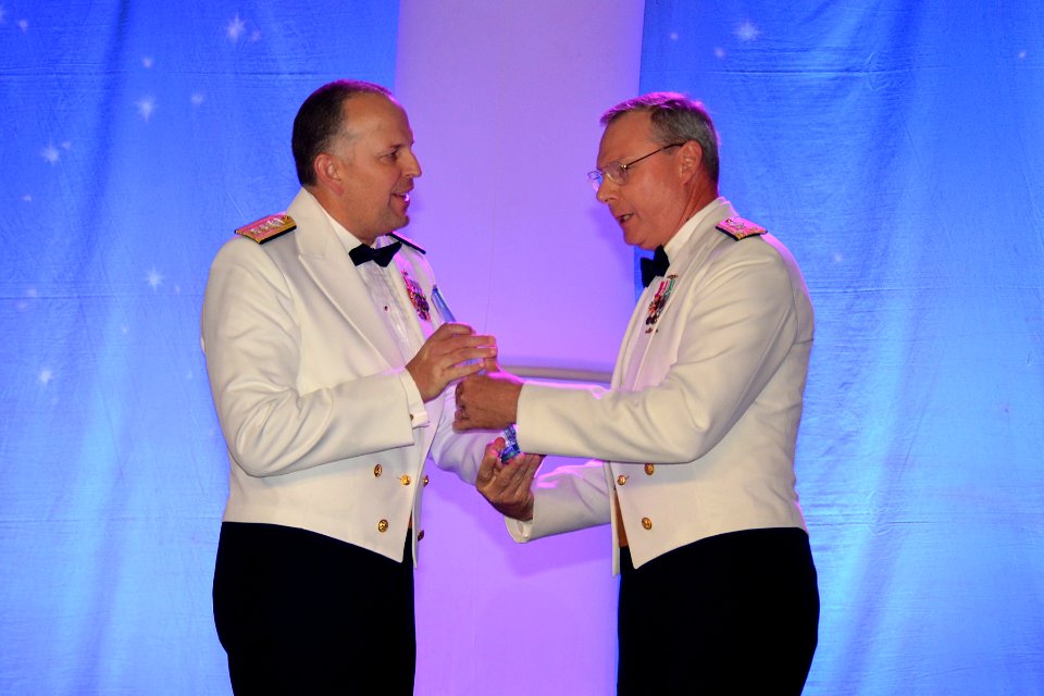 US Navy 111007-N-ZZ999-001 Rear Adm. Patrick H. Brady, commander of Space and Naval Warfare Systems Command (SPAWAR), receives the 2011 Hispanic En