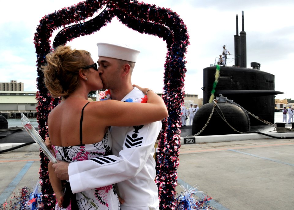 US Navy 111005-N-UK333-063 Electrician's Mate 1st Class Brian Lanham is greeted by his wife as he is the first to disembark when the Los Angeles-cl