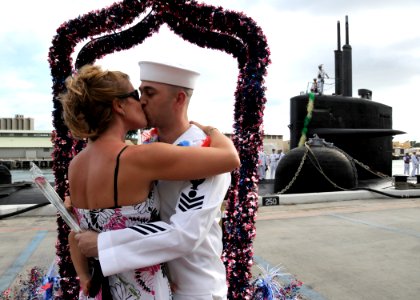 US Navy 111005-N-UK333-063 Electrician's Mate 1st Class Brian Lanham is greeted by his wife as he is the first to disembark when the Los Angeles-cl