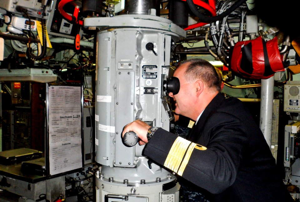 US Navy 111010-N-ZZ999-005 Rear Adm. Bernt Grimstvedt, chief of the Royal Norwegian Navy, looks through the periscope of the Los Angeles-class subm