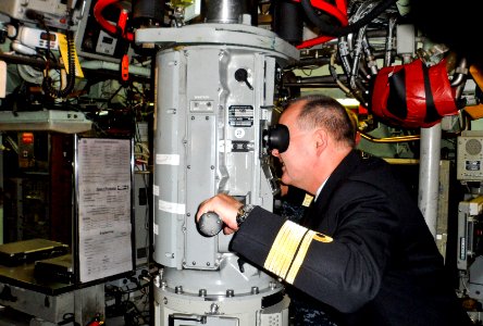 US Navy 111010-N-ZZ999-005 Rear Adm. Bernt Grimstvedt, chief of the Royal Norwegian Navy, looks through the periscope of the Los Angeles-class subm