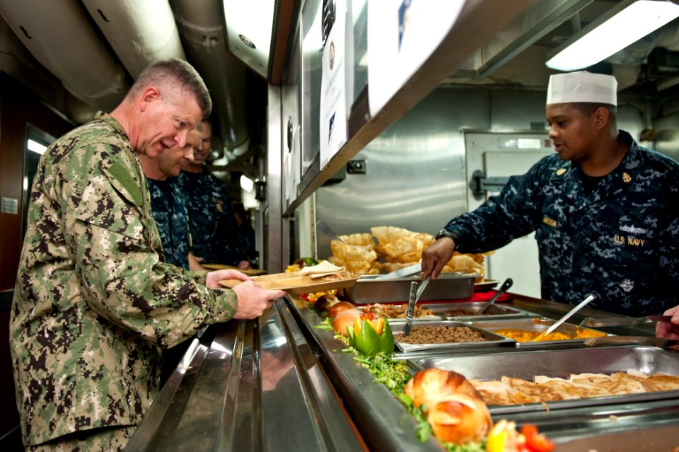 US Navy 111008-N-BT887-189 Master Chief Petty Officer of the Navy (MCPON) Rick D. West is served chow by Chief Culinary Specialist Quincy Lawson