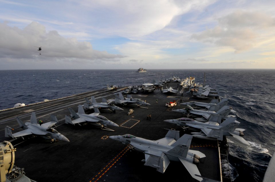 US Navy 111008-N-JO245-010 The aircraft carrier USS George Washington (CVN 73) approaches the Military Sealift Command dry cargo and ammunition shi