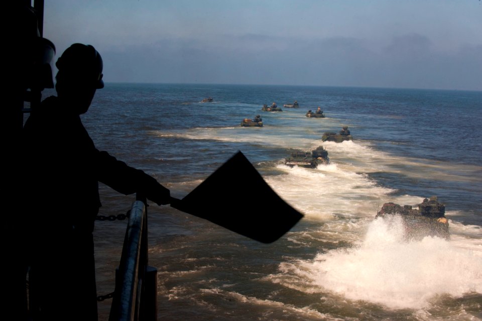 US Navy 111011-N-PB383-130 Amphibious assault vehicles (AAV) depart the well deck of the amphibious transport dock ship USS New Orleans (LPD 18)