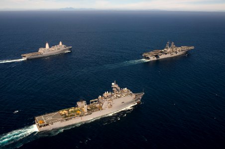 US Navy 111010-N-KD852-492 The amphibious dock landing ship USS Pearl Harbor (LSD 52), front, the amphibious assault ship Makin Island USS Makin Is