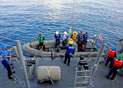 US Navy 111011-N-VH839-013 Sailors assigned to the Arleigh Burke-class guided-missile destroyer USS Dewey (DDG 105) lower a rigid-hull inflatable b