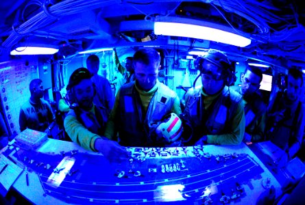 US Navy 111011-N-VN693-016 Aviation boatswain's mates prepare for night flight operations