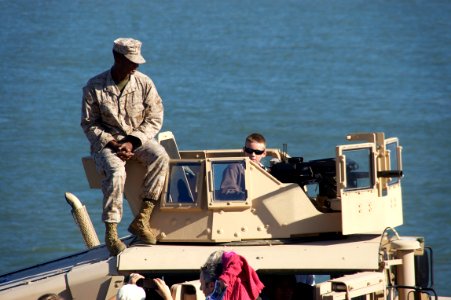 US Navy 111008-N-ZC343-187 Visitors talk to Sailors and Marines while viewing various displays of military equipment aboard the amphibious assault