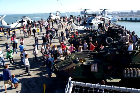 US Navy 111008-N-ZC343-189 Visitors talk to Sailors and Marines while viewing various displays of military equipment aboard the amphibious assault