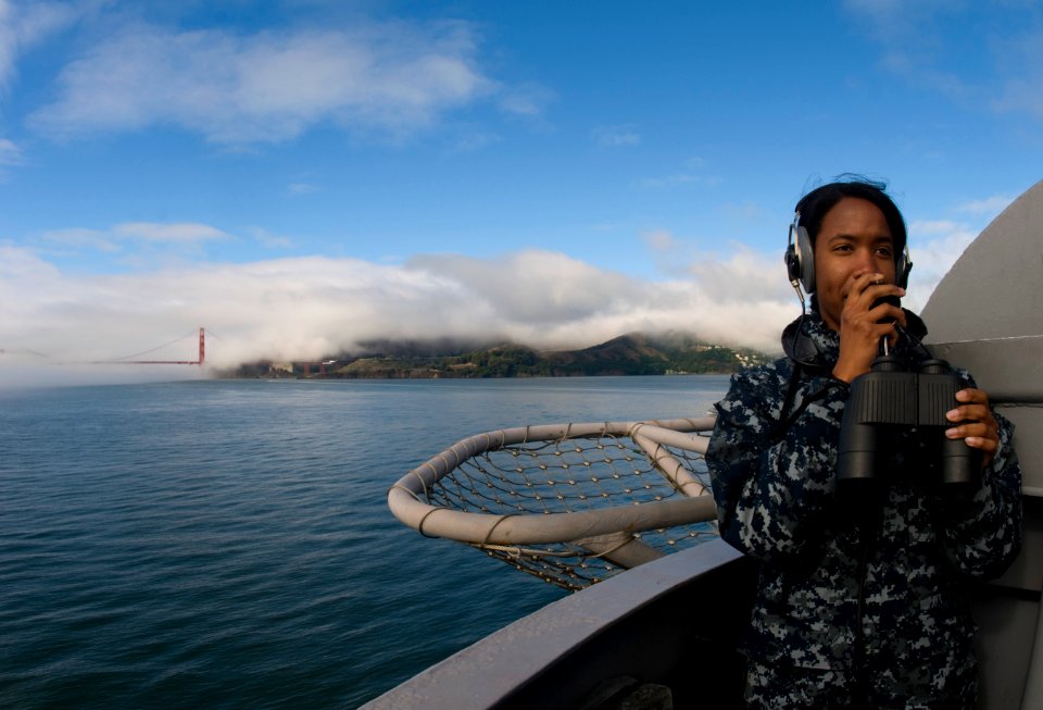 US Navy 111011-N-OK922-348 Operations Specialist 3rd Class Taneisha Swan stands lookout watch on the flight deck of the Nimitz-class carrier USS Ca