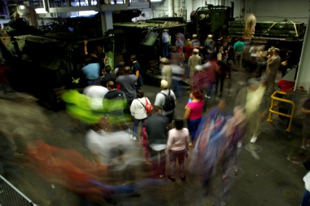 US Navy 111009-N-ZC343-278 Visitors stream through the amphibious vehicle displays in the upper vehicle stowage deck aboard the amphibious assault