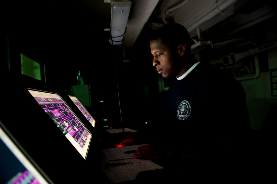 US Navy 111012-N-BT887-287 Aviation Boatswain's Mate (Fuel) 3rd Class Joshua Marcelon monitors a fuel purification system