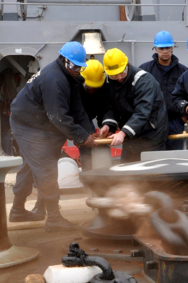 US Navy 111011-N-YX169-052 Seaman Recruit Christopher Newell, left, Boatswain's Mate Seaman Theodore Faison, and Boatswain's Mate 2nd Class Christo