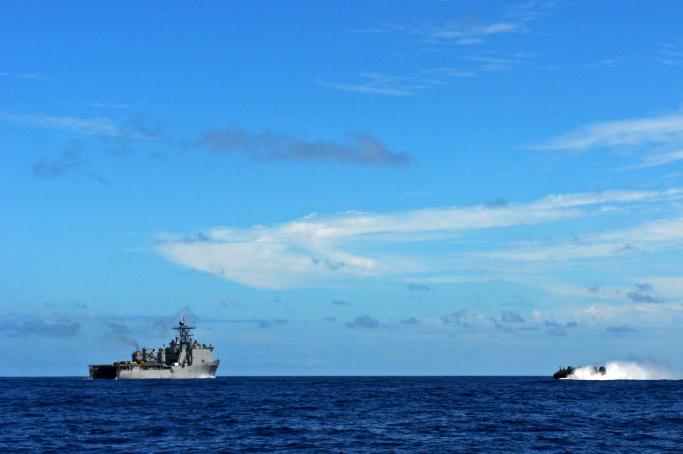 US Navy 111011-N-MW330-352 Landing Craft Air Cushion (LCAC) 9 heads towards the forward deployed amphibious dock landing ship USS Germantown (LSD 4