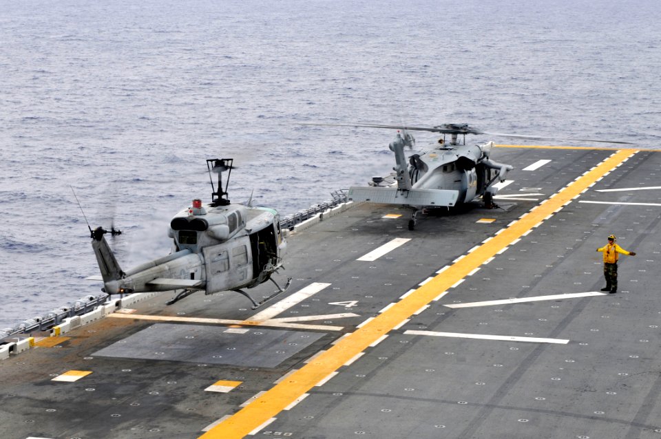 US Navy 111010-N-KM175-074 A UH-1N Huey helicopter assigned to the Marine Medium Helicopter Squadron (HMM) 265 takes off from the forward-deployed