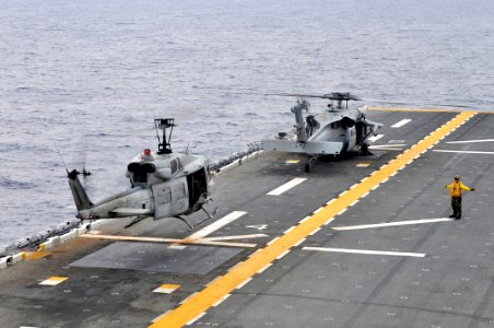 US Navy 111010-N-KM175-074 A UH-1N Huey helicopter assigned to the Marine Medium Helicopter Squadron (HMM) 265 takes off from the forward-deployed