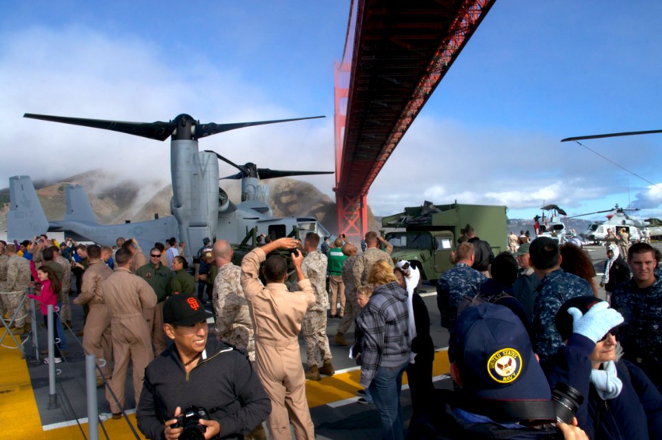 US Navy 111011-N-ZC343-422 Sailors, Marines and their guests participating in a tiger cruise watch from the flight deck of the amphibious assault