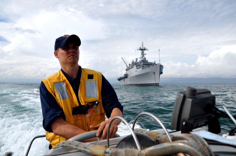 US Navy 111012-N-YX169-097 Seaman Jacob Gibson pilots a rigid-hull inflatable boat from the amphibious transport dock USS Ponce (LPD 15)