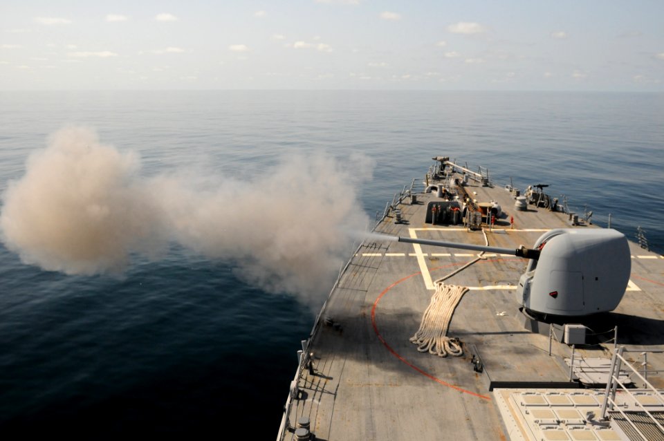 US Navy 111013-N-XQ375-003 The guided-missile destroyer USS Mitscher (DDG 57) fires its MK-45 5-inch-54-caliber lightweight gun