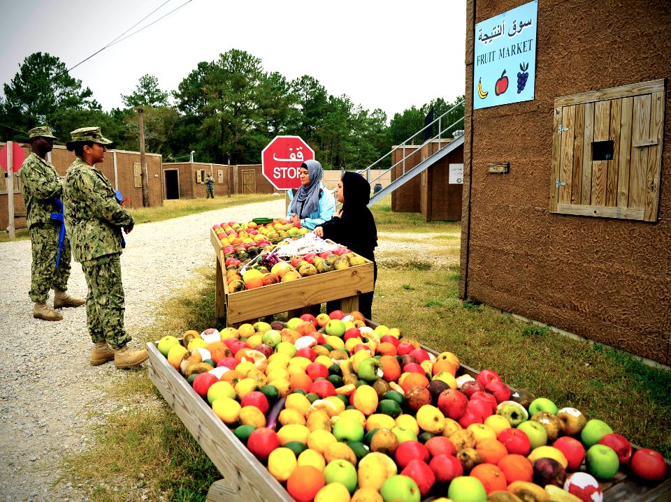 US Navy 111012-N-KB666-013 Chief Logistics Specialist Olivia Sturgeon, center, assigned to Mobile Civil Affairs and Security Training (MCAST) comma