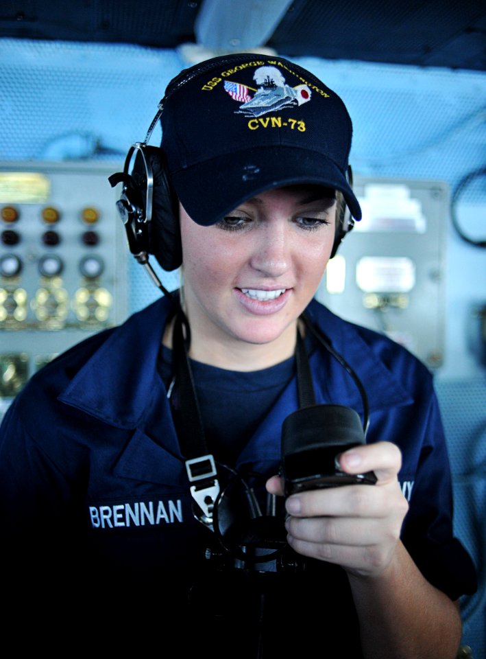 US Navy 111012-N-SF704-005 Seaman Jillian Brennan, from Boston, speaks into a sound-powered phone on the navigation bridge aboard the aircraft carr