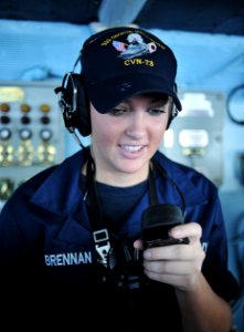 US Navy 111012-N-SF704-005 Seaman Jillian Brennan, from Boston, speaks into a sound-powered phone on the navigation bridge aboard the aircraft carr